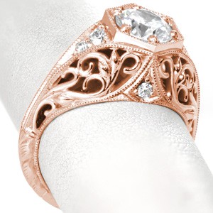 Rose gold engagement ring in Nashville with filigree,  round center stone and octagonal size prong mounting.